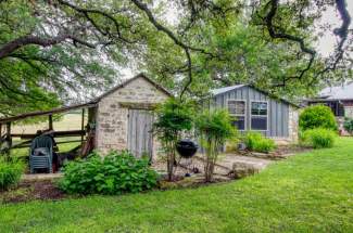 Storage shed, old smoke house and old blacksmith shop