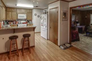 Kitchen looking into living room