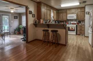 Kitchen looking into sunroom