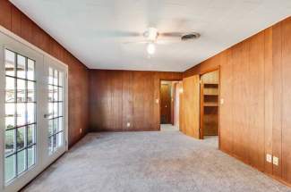 1 bedroom unit: bedroom with closet and backdoor