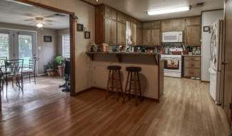 Kitchen looking into sunroom