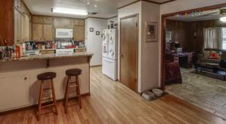 Kitchen looking into living room