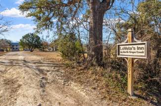 1-driveway-entry-with-sign